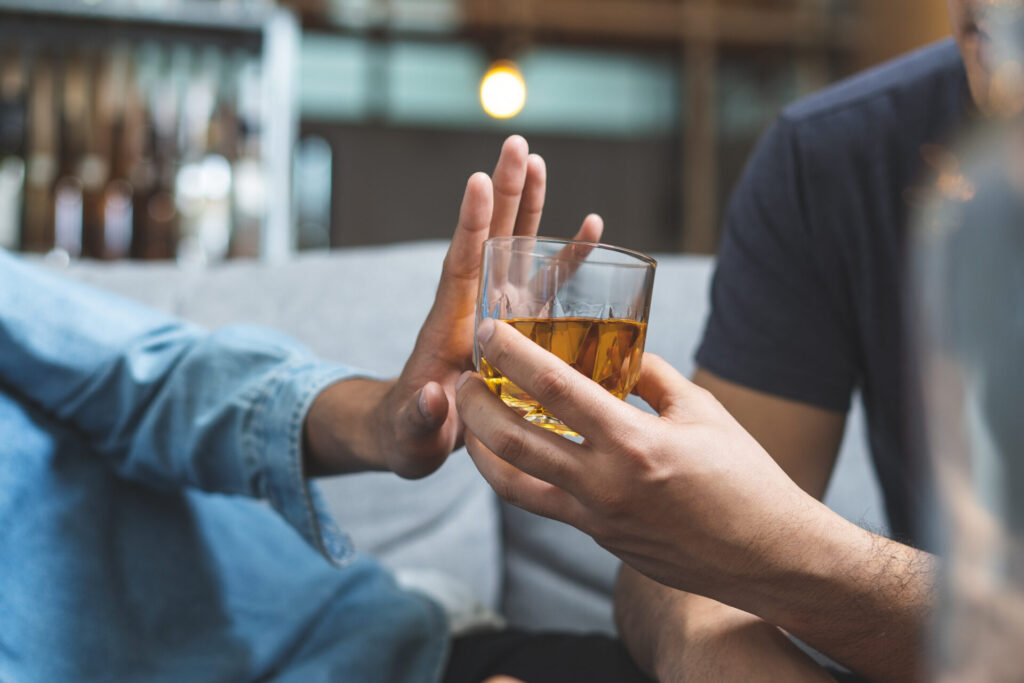 Stop alcohol concept - person refusing to drink